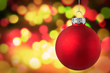 Christmas red bauble over bokeh background