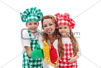 Kids and their mother preparing food together