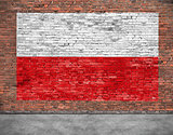 Flag of Poland painted on old brick wall