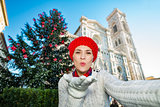 Woman tourist making selfie in Christmas decorated Florence