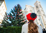 Seen from behind woman enjoying to be in Italy on Christmas time