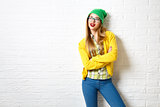 Street Style Hipster Girl at White Brick Wall Background