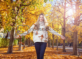 Young woman enjoying the colors of autumn