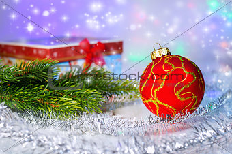 Red Christmas ball, fir branch and with gift box. Christmas deco