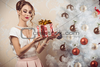 elegant woman with xmas gift 