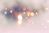 Christmas background with snow and bokeh lights