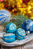Blue macarons with Christmas decor.
