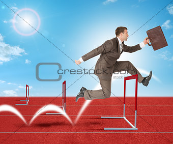 Man hopping over treadmill barrier