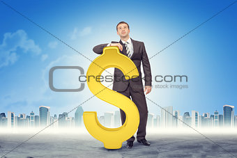 Businessman leaning on dollar sign