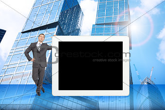 Businessman and big tablet with blank screen