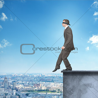 Man walking from edge of building roof