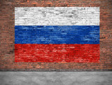 Flag of Russsia on brick wall with part of foreground