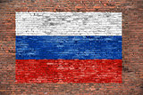 Flag of Russsia painted over brick wall