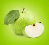 Green apple with leaf and slice