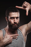 portrait of beardy man in singlet