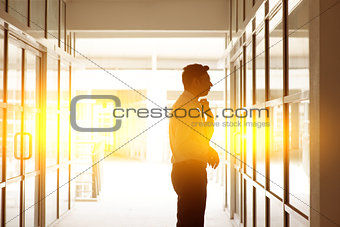 Indian businessman grooming in front office mirror