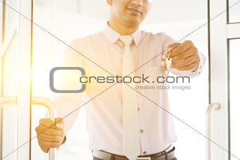 Asian Indian people holding office key