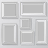 Set of white photo frames on grey background