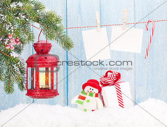 Christmas candle lantern, gift box and blank photos