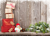 Christmas gift boxes and snowman toy