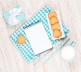 Cup of milk, heart shaped cookies, gift box and notepad