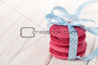 Red macarons with blue ribbon