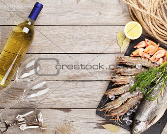 Fresh raw sea food with spices and white wine