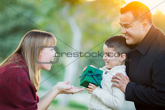 Young Mixed Race Son Handing Gift to His Mom