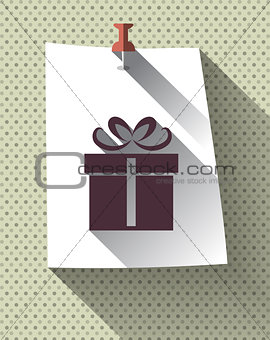 Gift box sign on sticky paper attached with pin on pattern back