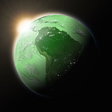 Sun over South America on green planet Earth