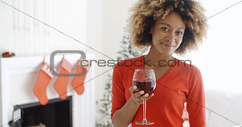 Young woman offering a Christmas toast