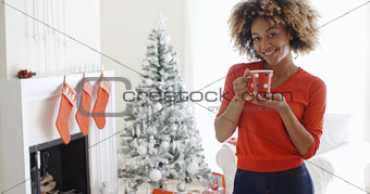 Friendly smiling young woman celebrating Christmas