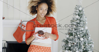 Happy young African woman celebrating Christmas