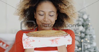 Young woman with a fresh Christmas tart