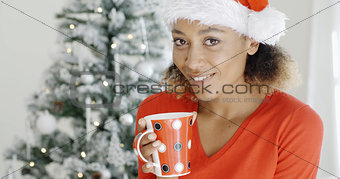 Young girl enjoying coffee on Christmas Day