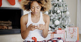 Serious woman checking for Christmas messages
