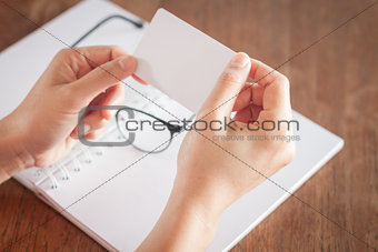 Woman hold blank business cards 