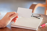 Woman hold blank business cards 
