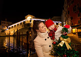 Happy mother and daughter in Venice looking on Christmas tree