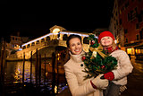Mother and daughter with Christmas tree near Rialto Bridge
