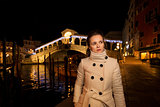 Elegant young woman. Rialto. Christmas time in Venice, Italy