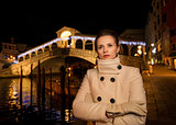 Woman in white coat. Rialto. Christmas time in Venice, Italy