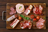 Assorted deli meats - ham, sausage, salami, parma, prosciutto, bacon