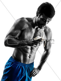 man exercising fitness eating Banana silhouette