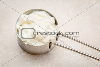 measuring cup of Greek yogurt