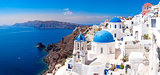 Panoramic scenic view of beautiful white houses on Santorini