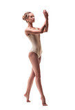 young beautiful dancer in beige swimsuit