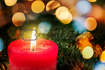 red candle with branch