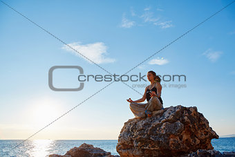 young woman in the lotus position