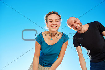 man and woman looks into the camera